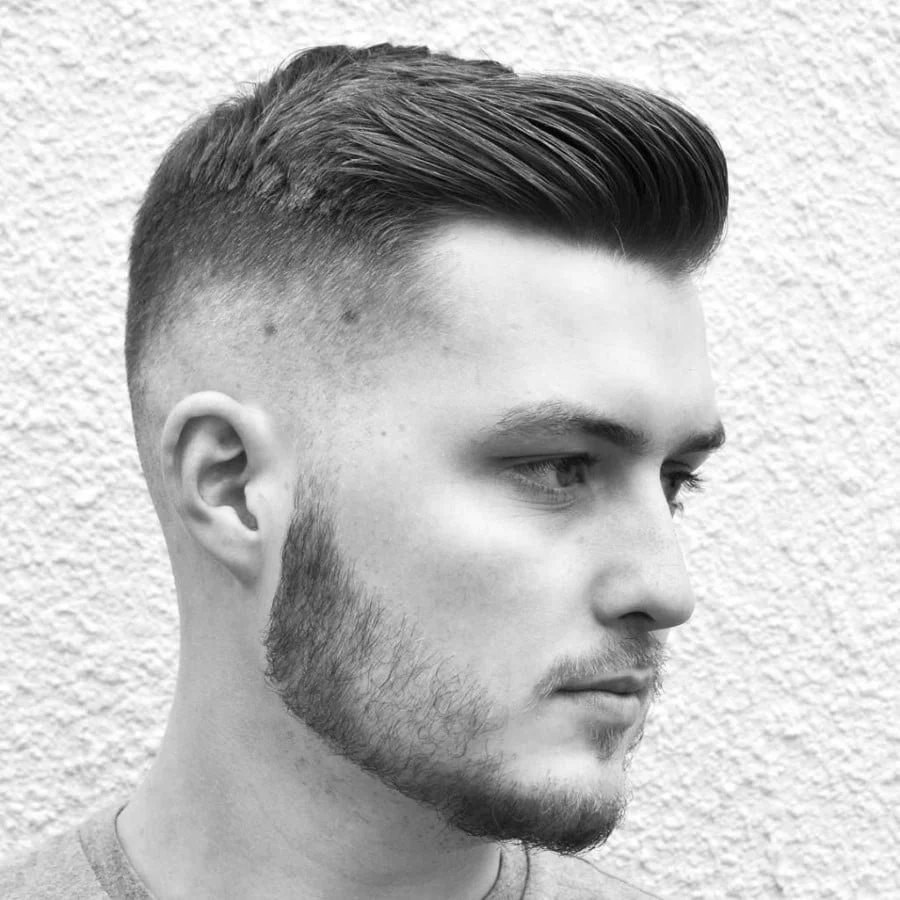 short skinfade with slick back hair on male model